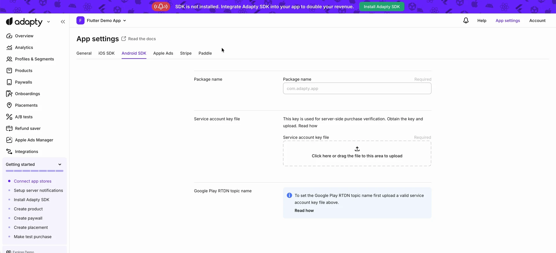 Android SDK tab of App settings in Adapty, showing the Package name field and the Service account key file upload area